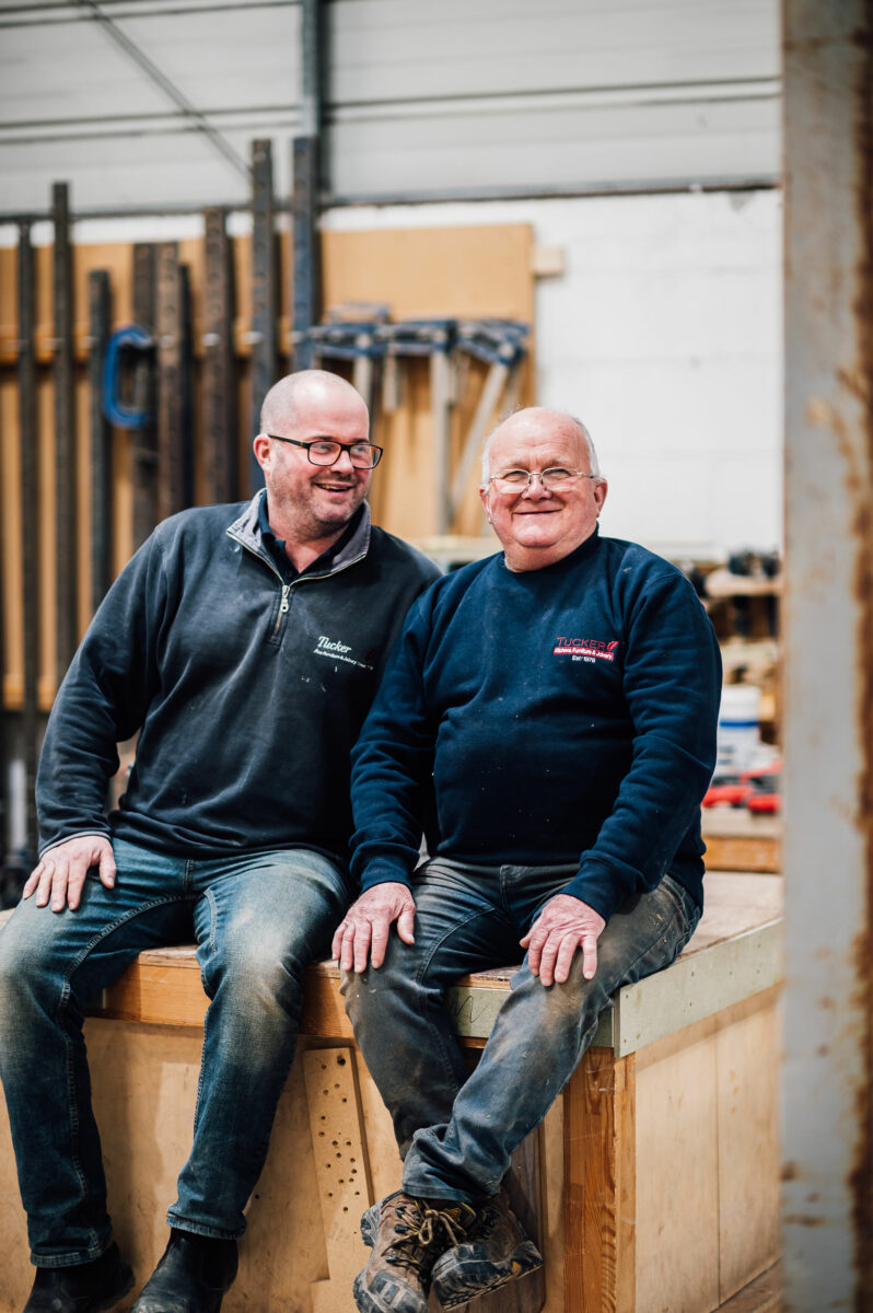 Dave and Lee Tucker, sitting together in the Tucker Joinery Workshop.