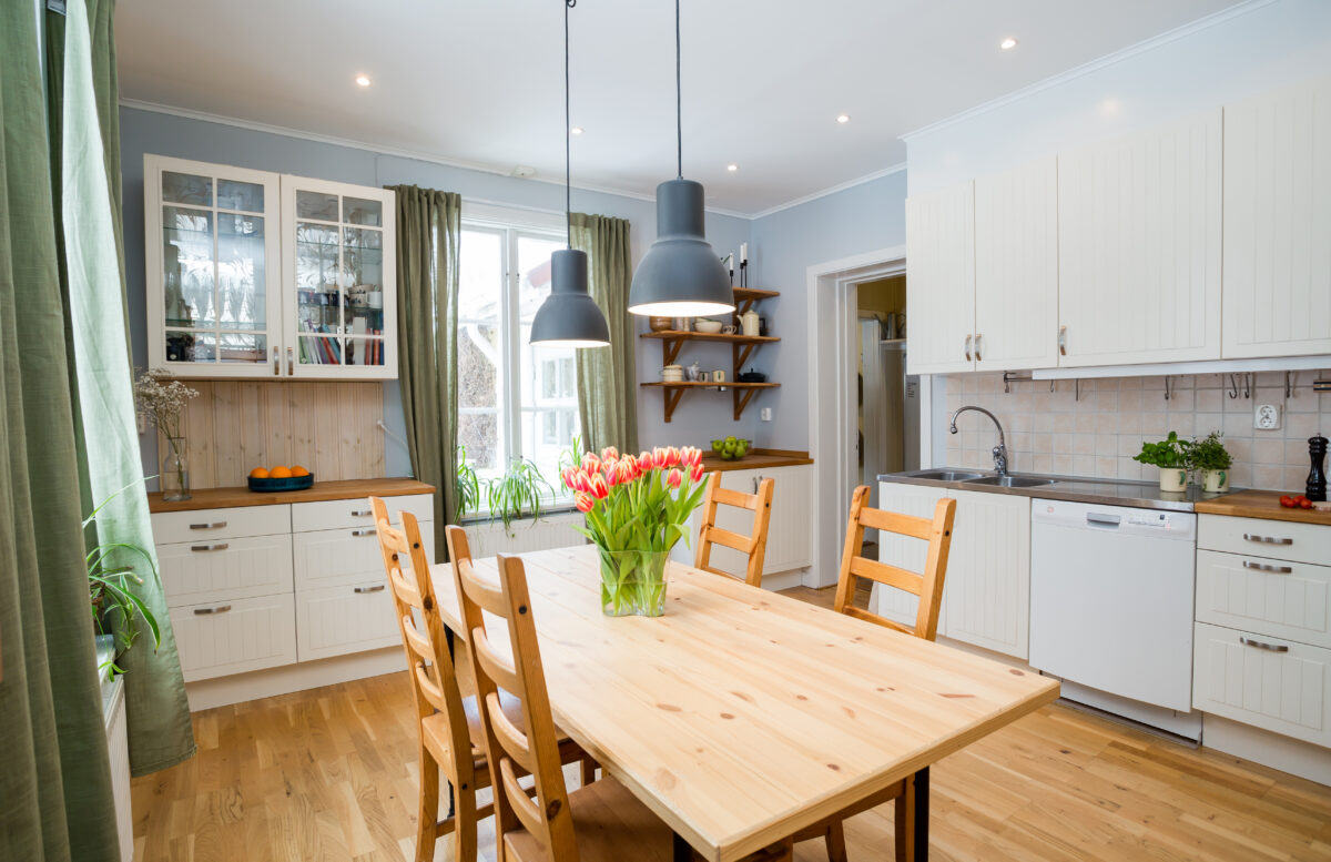 Modern kitchen with interior and flowers on the table