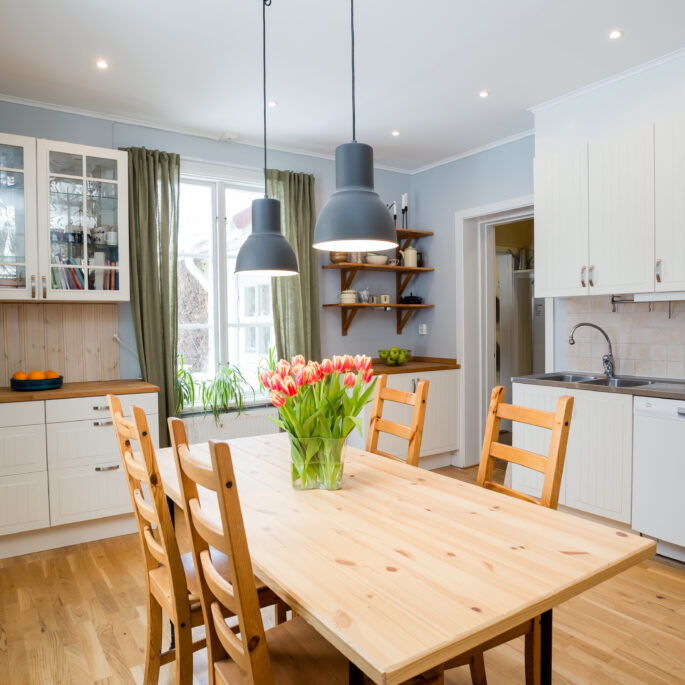 Modern kitchen with interior and flowers on the table