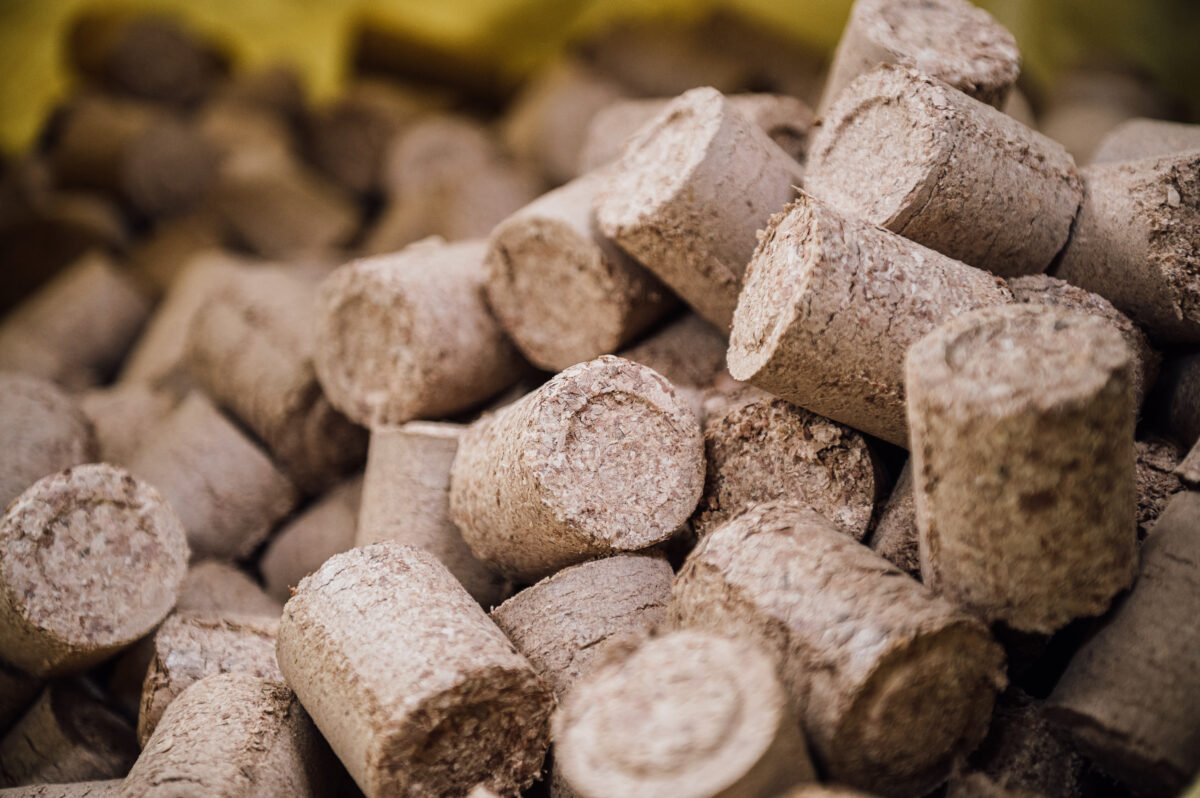 A pile of woodburner briquettes, ready for the fireplace, sits in the Tucker Joinery workshop.